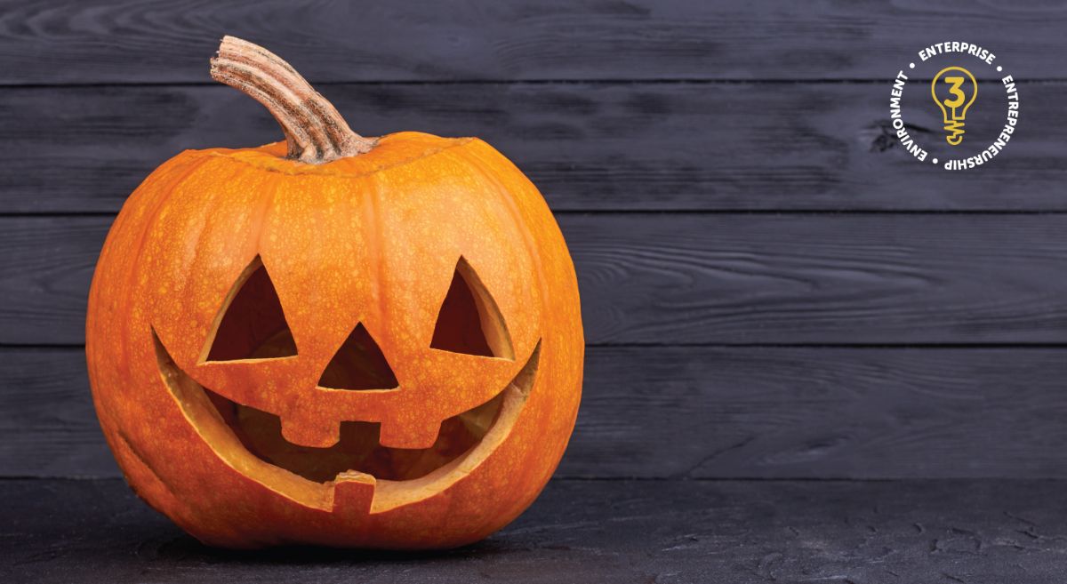 Picture of a Halloween pumpkin beside the SERC Enterprise, Entrepreneurship and Environment team logo.